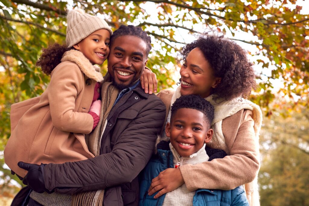 Smiling family enjoying a day together after receiving gentle, comprehensive care at Twin Oaks Dental Studio in Valley Park, MO