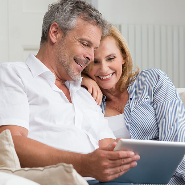 Couple reviewing information together after visiting a Valley Park MO dental clinic